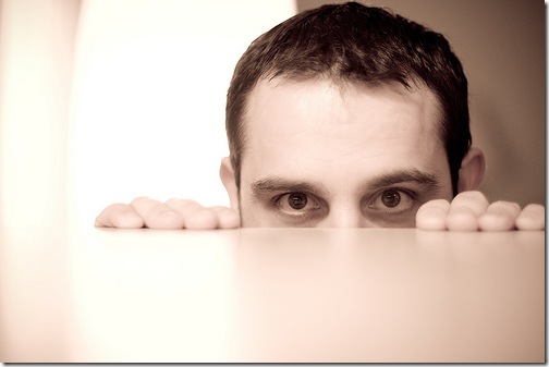 Man Peeking over Tabletop